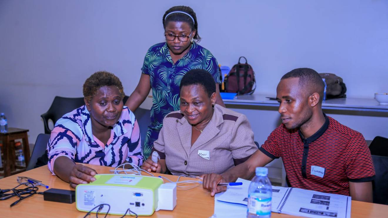 Dr. Julianna Nanimambi from CoRSU Hospital Uganda (second left, standing) engages anaesthesia professionals from hospitals across East Africa during a Capnography training at the Hospital. PHOTO/COURTESY